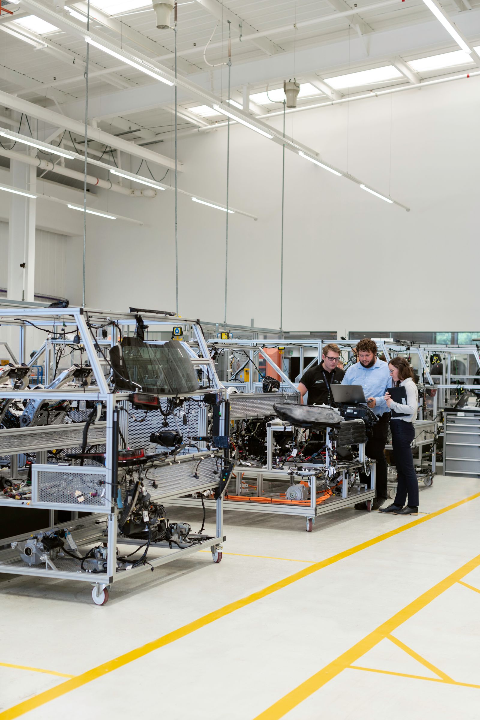 Engineers reviewing work in a manufacturing workshop