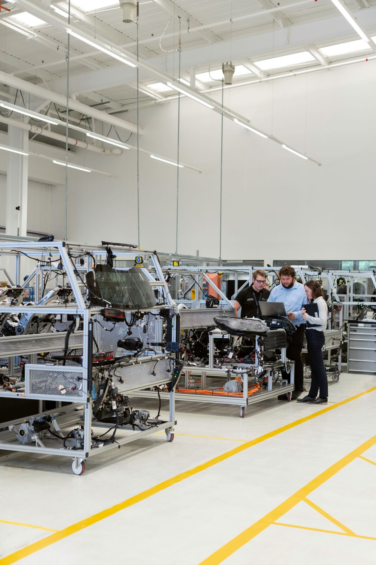 Engineers reviewing work in a manufacturing workshop